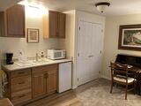 Kitchenette with sink, refrig, microwave, dishes