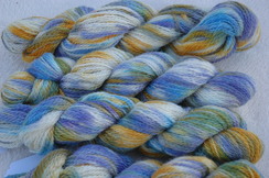 Photo of Blue, green and gold yarn