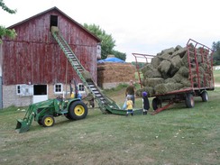 Loading hay into our barn's loft!