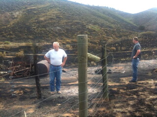 Ron & Sean evaluating fence damage from fire