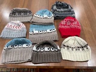 An assortment of hand knit hats