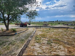 Glenn spreading asphalt