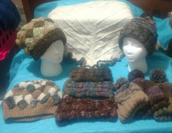 Entrelac hats, ear bands, and pom pom hats knit from our hand-spun yarns