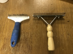 A dog shedding rake and metal comb used for harvesting fiber