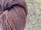 This yarn shows marled undertone of natural fiber colors